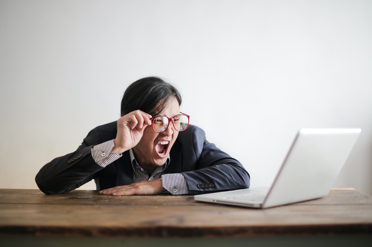 Angry Man Looking at the Laptop