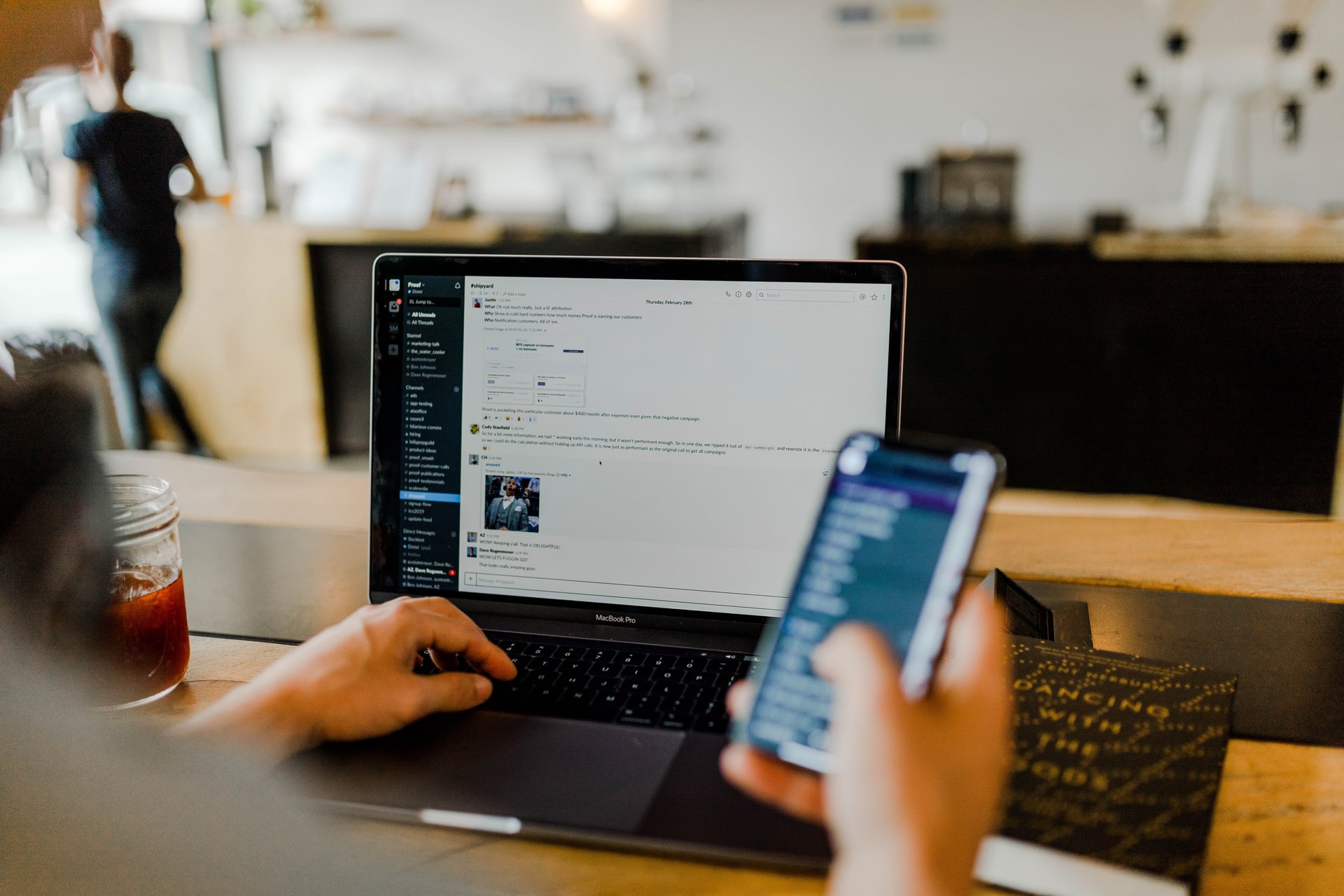 Person on laptop and phone