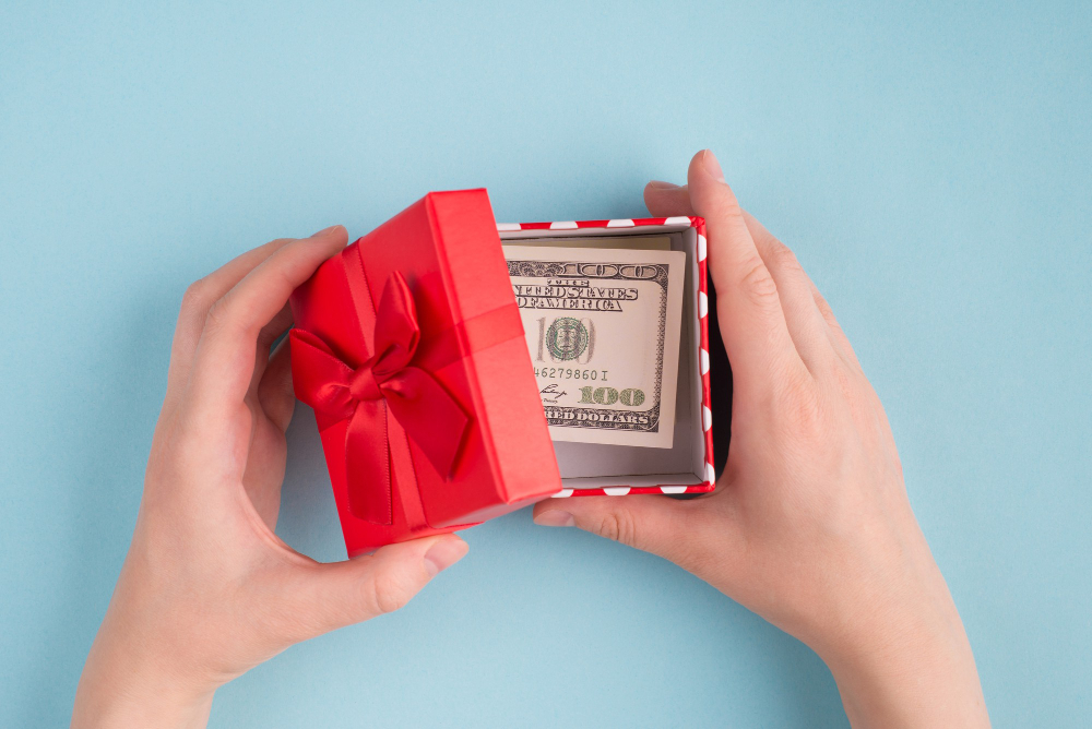 A Photo of Female Hands Open Box With 100 American Banknote