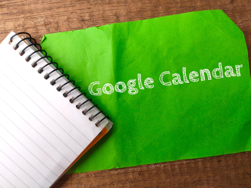 Notebook and Colored Notepaper With Text Google Calendar